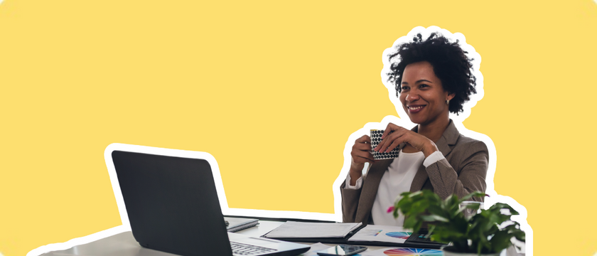 Lawyer at her desk enjoying her coffee and the success of her SEO keyword tool for her website